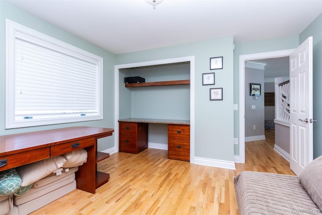 6081 Byram Lake Dr, Linden, MI 48451 - unfurnished office with light wood-type flooring and built in study area