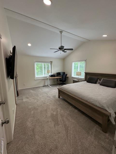 1727 Pero Lake Rd, Lapeer, MI 48446 - bedroom with multiple windows, carpet floors, vaulted ceiling, a desk, and a ceiling fan