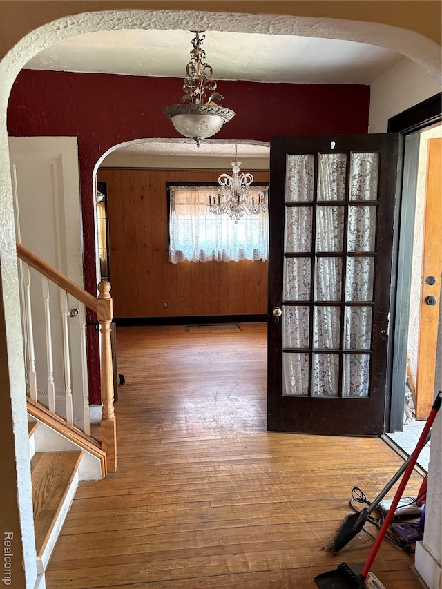 4206 Devonshire Rd, Lincoln Park, MI 48224 - foyer with arched walkways, hardwood / wood-style flooring, a chandelier, stairs, and healthy amount of natural light