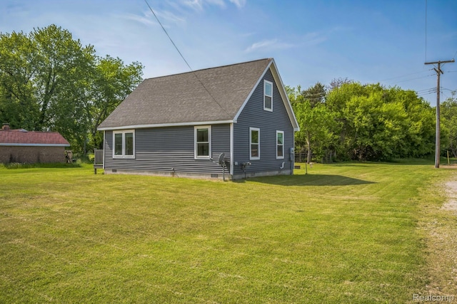 6195 Falkenbury Rd, North Branch, MI 48461 - back of house featuring a yard and roof with shingles