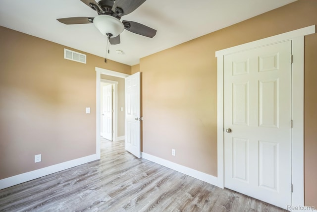 6195 Falkenbury Rd, North Branch, MI 48461 - unfurnished bedroom with baseboards, wood finished floors, and ceiling fan