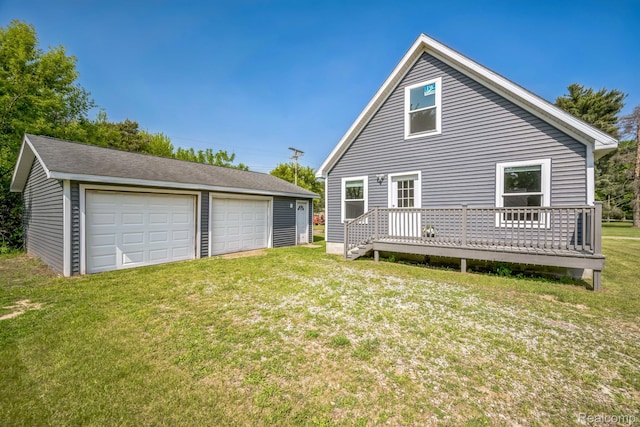 6195 Falkenbury Rd, North Branch, MI 48461 - rear view of property featuring an outbuilding, a garage, a deck, and a yard