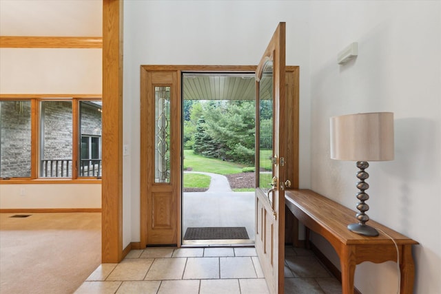 3438 Sandy Shore Dr, Metamora, MI 48455 - foyer entrance featuring light carpet and baseboards