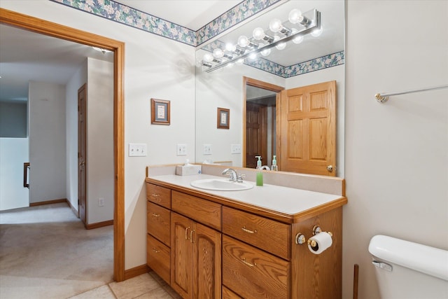 3438 Sandy Shore Dr, Metamora, MI 48455 - bathroom with vanity, toilet, and baseboards