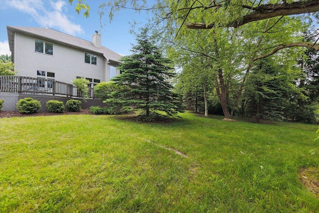 3438 Sandy Shore Dr, Metamora, MI 48455 - view of green lawn with a wooden deck