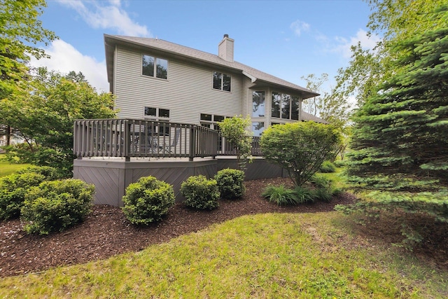 3438 Sandy Shore Dr, Metamora, MI 48455 - back of house with a chimney and a deck