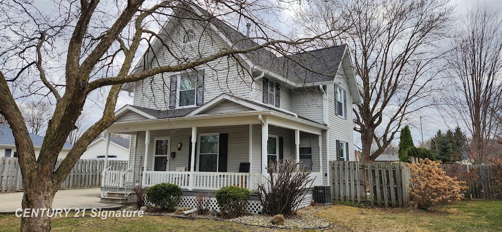 632 S Chapman St, Chesaning, MI 48616 - view of front facade with covered porch, roof with shingles, and central AC unit