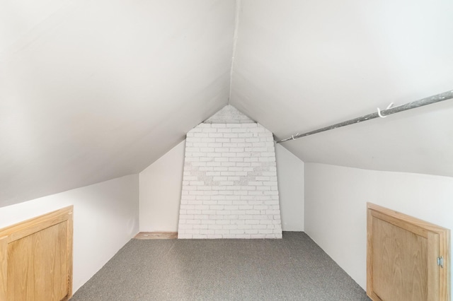 2958 E Stewart Rd, Midland, MI 48640 - additional living space featuring vaulted ceiling and carpet floors