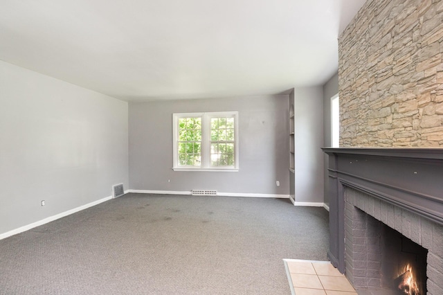 2958 E Stewart Rd, Midland, MI 48640 - unfurnished living room with a fireplace, baseboards, and carpet floors