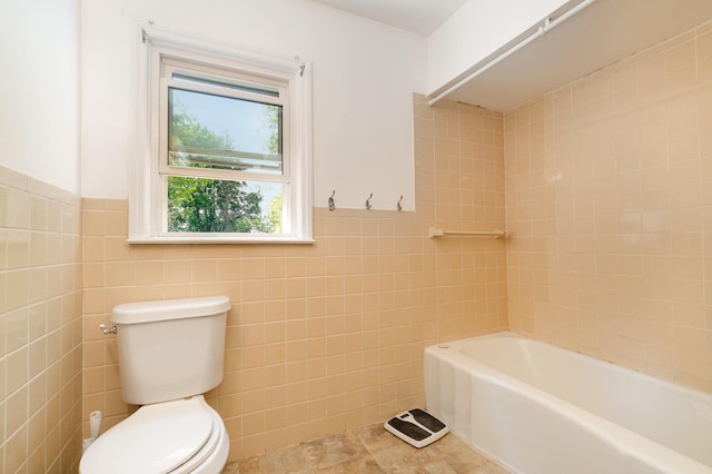 2958 E Stewart Rd, Midland, MI 48640 - full bath with toilet, tile walls, a bath, wainscoting, and tile patterned floors