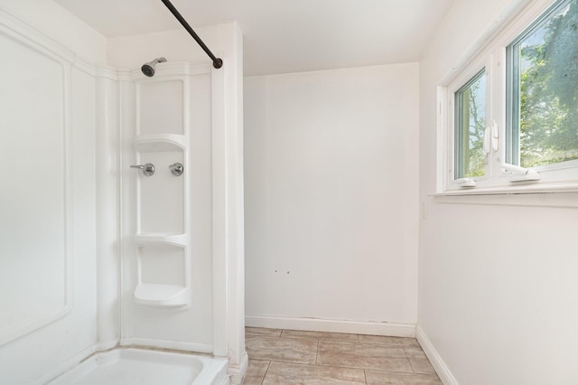 2958 E Stewart Rd, Midland, MI 48640 - bathroom with a shower and baseboards