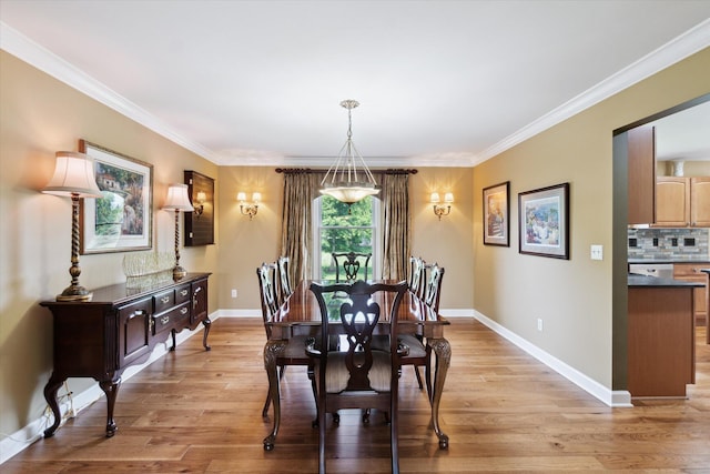 2056 Merlot Ct, Ann Arbor, MI 48108 - dining room featuring light wood finished floors, crown molding, and baseboards
