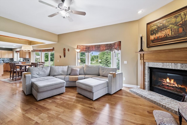 2056 Merlot Ct, Ann Arbor, MI 48108 - living area with light wood-style floors, a fireplace, ceiling fan, and recessed lighting