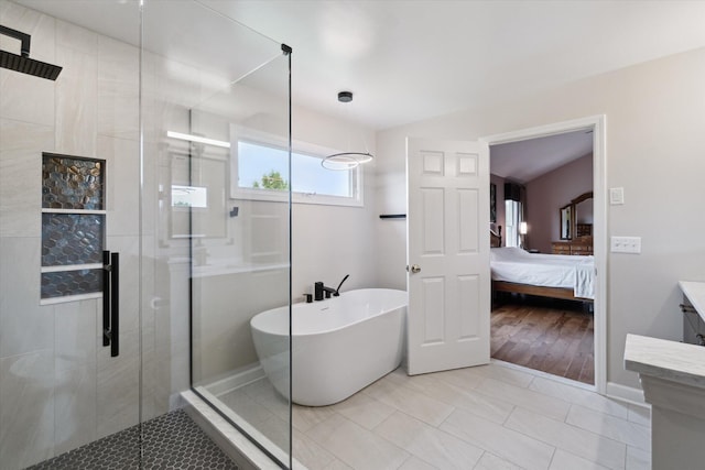 2056 Merlot Ct, Ann Arbor, MI 48108 - bathroom featuring a shower stall, a freestanding bath, vanity, and ensuite bathroom