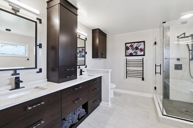 2056 Merlot Ct, Ann Arbor, MI 48108 - full bath with toilet, double vanity, a stall shower, and baseboards