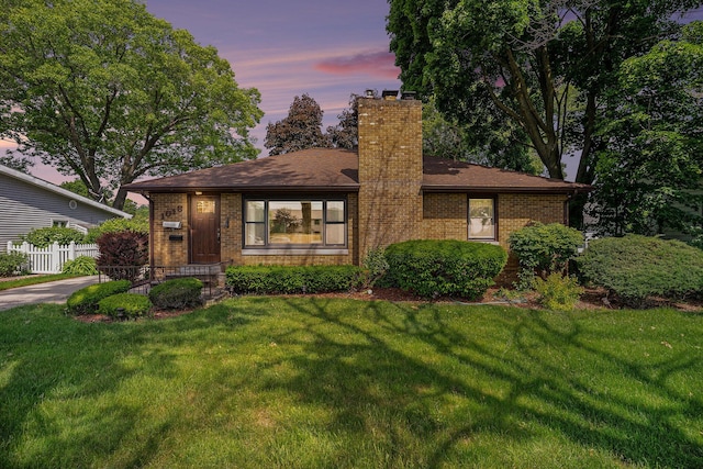 1018 Ruddiman Dr, North Muskegon, MI 49445 - view of front of home featuring a chimney and brick siding