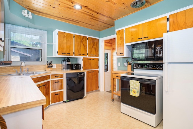 1018 Ruddiman Dr, North Muskegon, MI 49445 - kitchen featuring black appliances, a sink, wood ceiling, light countertops, and recessed lighting