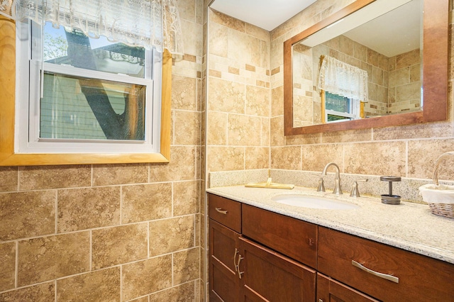 1018 Ruddiman Dr, North Muskegon, MI 49445 - bathroom with vanity and tile walls