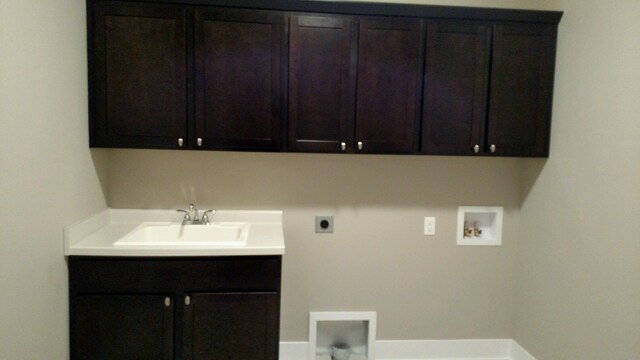 9421 Sassafras Trl Unit 76, Portage, MI 49002 - washroom with cabinet space, electric dryer hookup, and washer hookup