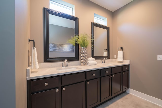 9421 Sassafras Trl Unit 76, Portage, MI 49002 - full bathroom featuring double vanity and baseboards