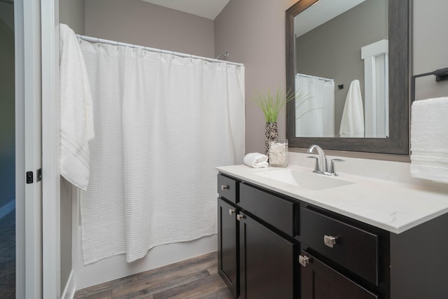 9421 Sassafras Trl Unit 76, Portage, MI 49002 - bathroom with vanity, wood finished floors, and shower / bath combo