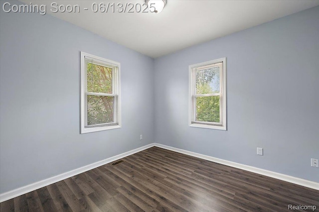 233 W 11 Mile Rd, Madison Heights, MI 48071 - unfurnished room featuring baseboards and dark wood-style flooring