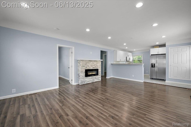 233 W 11 Mile Rd, Madison Heights, MI 48071 - unfurnished living room featuring recessed lighting, dark wood finished floors, and a fireplace