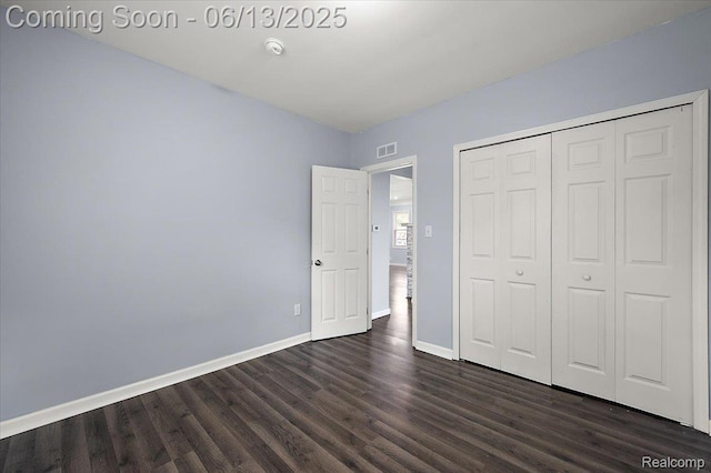 233 W 11 Mile Rd, Madison Heights, MI 48071 - unfurnished bedroom featuring dark wood-type flooring and a closet