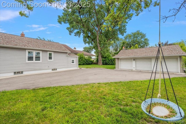 233 W 11 Mile Rd, Madison Heights, MI 48071 - view of grassy yard with a garage