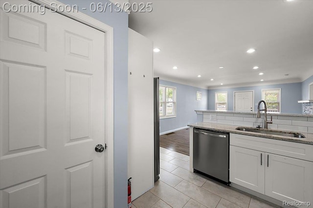 233 W 11 Mile Rd, Madison Heights, MI 48071 - kitchen with dishwasher, plenty of natural light, light stone countertops, white cabinets, and recessed lighting