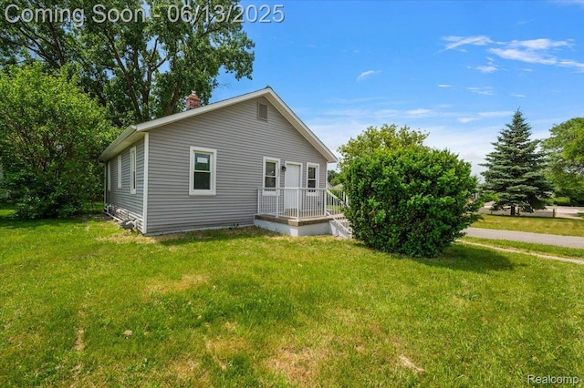 233 W 11 Mile Rd, Madison Heights, MI 48071 - view of front of home featuring a front yard and a chimney