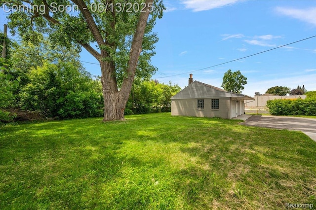 233 W 11 Mile Rd, Madison Heights, MI 48071 - view of green lawn with asphalt driveway