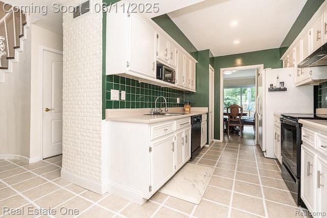 104 Manor Way Unit 1, Rochester Hills, MI 48309 - kitchen featuring a sink, black appliances, light countertops, white cabinetry, and recessed lighting