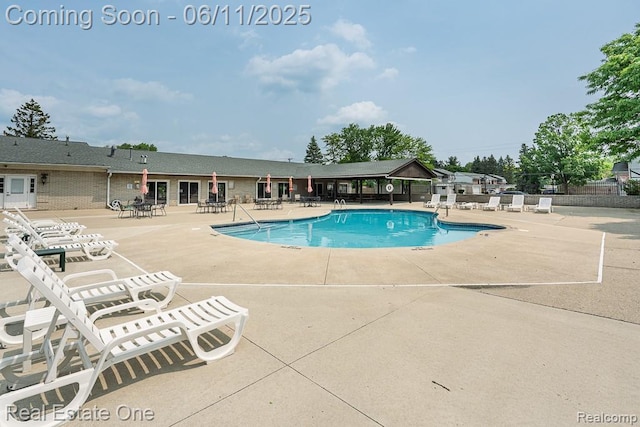 104 Manor Way Unit 1, Rochester Hills, MI 48309 - community pool featuring a patio