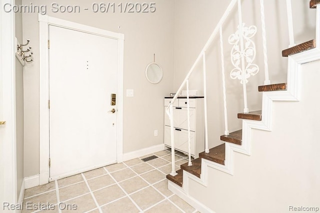 104 Manor Way Unit 1, Rochester Hills, MI 48309 - entryway featuring stairs and baseboards