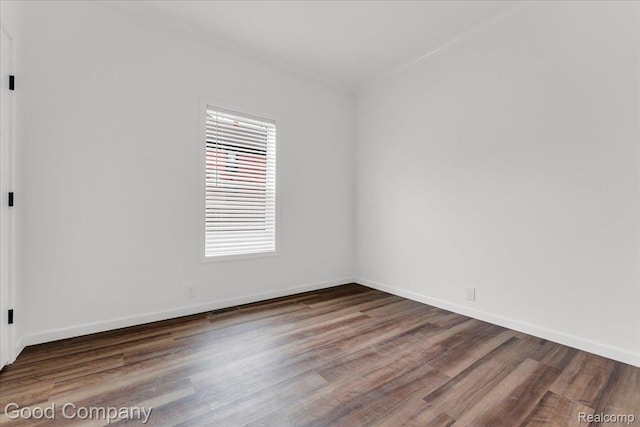 2826 16th St, Detroit, MI 48216 - spare room featuring wood finished floors and baseboards