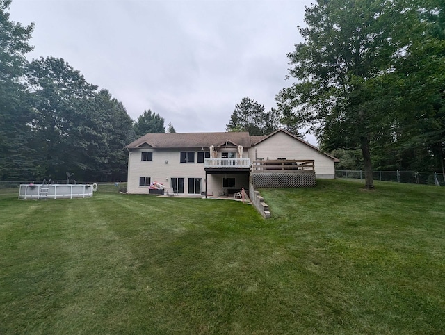 8544 Esmond Rd, Hale, MI 48739 - rear view of property featuring a deck and an outdoor pool