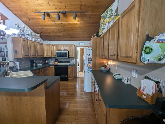 8544 Esmond Rd, Hale, MI 48739 - kitchen featuring electric stove, stainless steel microwave, track lighting, dark countertops, and wooden ceiling