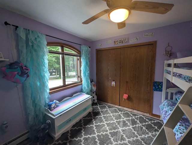 8544 Esmond Rd, Hale, MI 48739 - bedroom with a baseboard radiator, ceiling fan, and a closet
