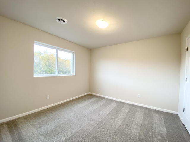 4272 Butternut Dr, Wayland, MI 49348 - empty room with dark colored carpet and baseboards