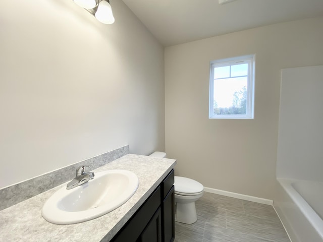 4272 Butternut Dr, Wayland, MI 49348 - bathroom with toilet, vanity, a tub to relax in, baseboards, and a shower