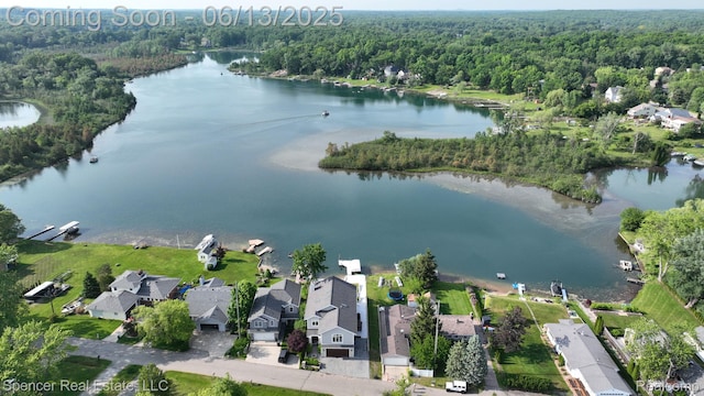 579 Dunleavy Dr, Highland, MI 48356 - aerial overview of property's location with a forest and a nearby body of water
