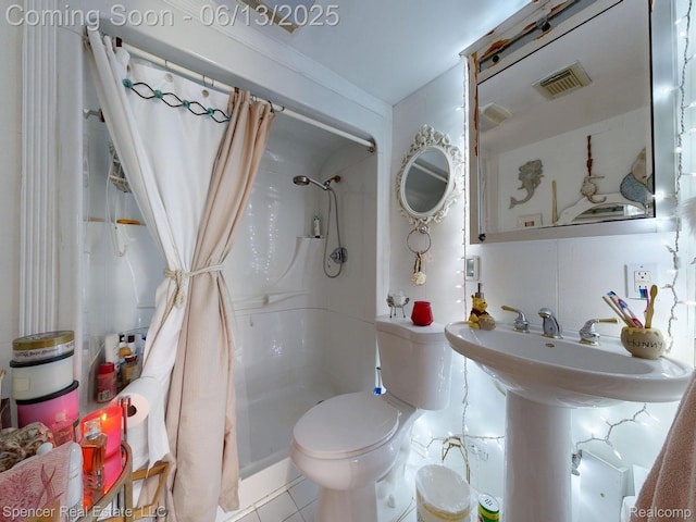 579 Dunleavy Dr, Highland, MI 48356 - bathroom with toilet, curtained shower, and tile patterned floors