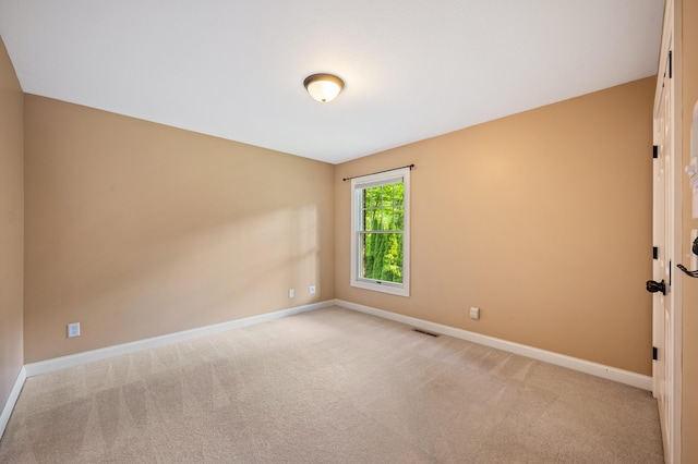 3265 Estates Dr, Saint Joseph, MI 49085 - unfurnished room featuring baseboards and light carpet