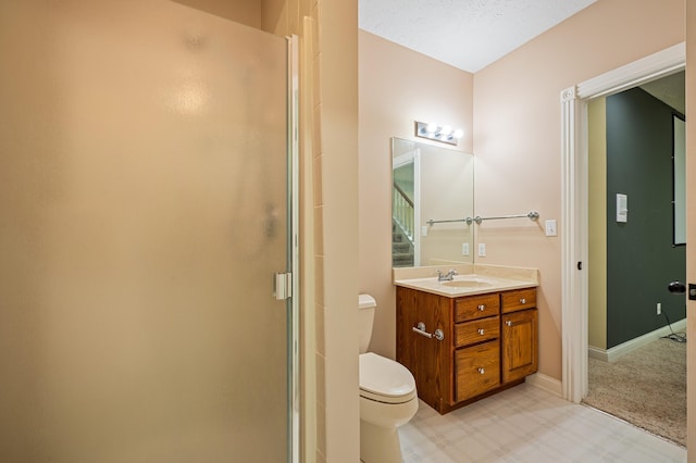 3265 Estates Dr, Saint Joseph, MI 49085 - full bath with toilet, vanity, a stall shower, and baseboards