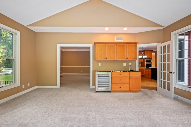 3265 Estates Dr, Saint Joseph, MI 49085 - bar area with wine cooler, lofted ceiling, light colored carpet, baseboards, and recessed lighting