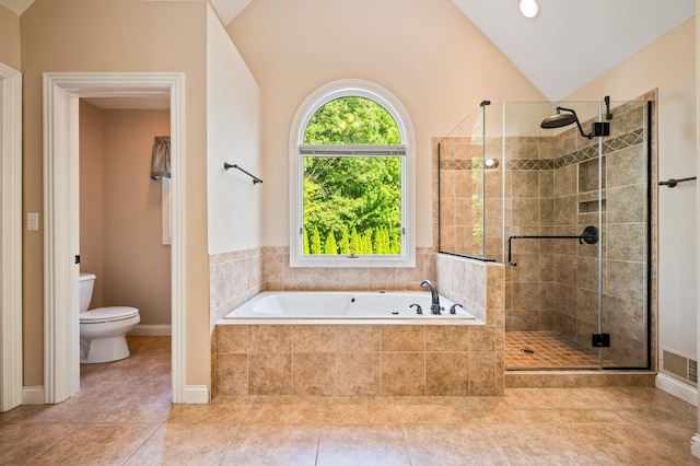 3265 Estates Dr, Saint Joseph, MI 49085 - bathroom with a garden tub, a stall shower, vaulted ceiling, toilet, and tile patterned floors