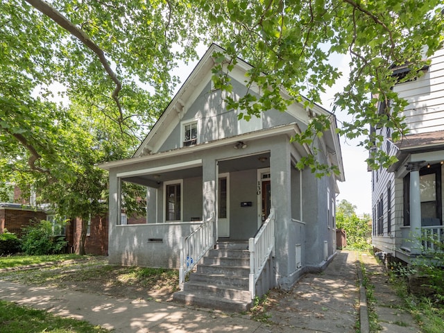 130 W Dutton St, Kalamazoo, MI 49007 - view of front facade featuring covered porch and crawl space