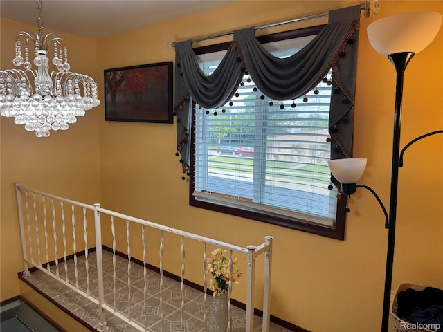 30347 Dell Ln, Warren, MI 48092 - stairway with a chandelier and baseboards