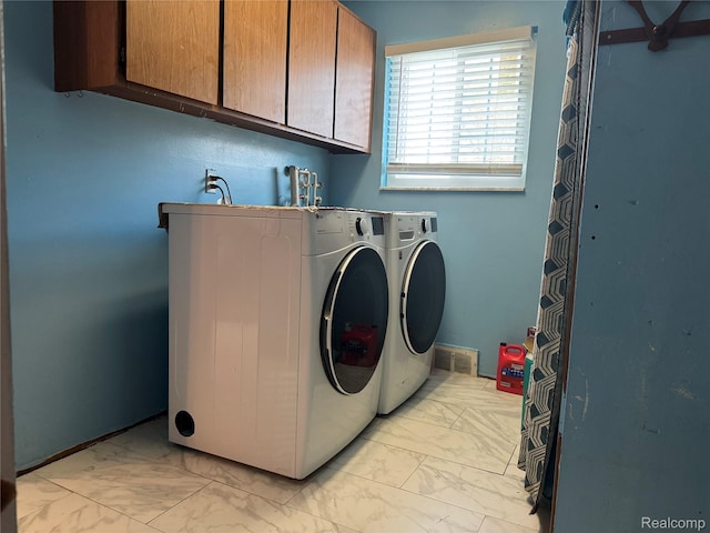30347 Dell Ln, Warren, MI 48092 - laundry area featuring light marble finish flooring, cabinet space, and washing machine and clothes dryer